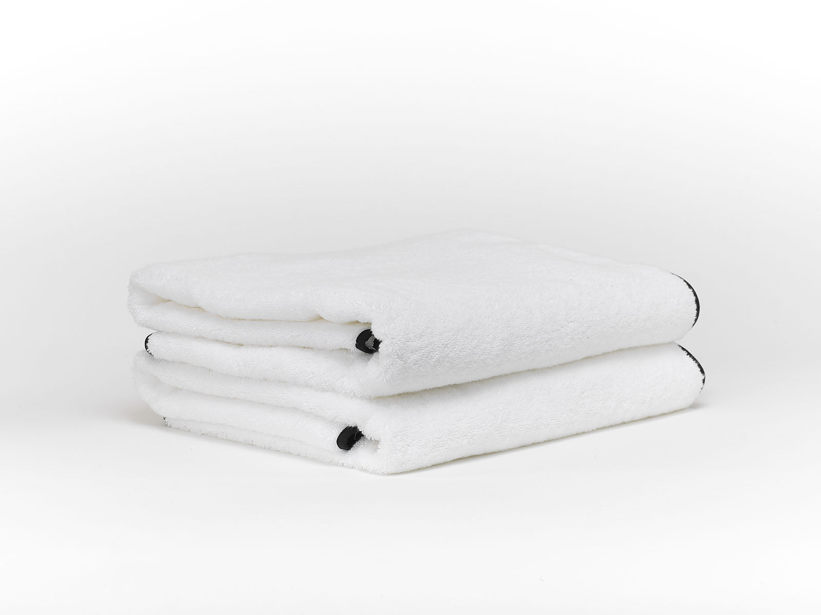 Serviette éponge avec biais Manhattan Brodline